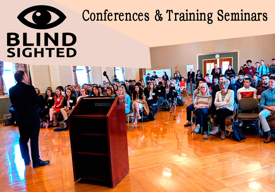 Charlie Speaking at a Leadersip Seminar with the Blind Sighted Logo